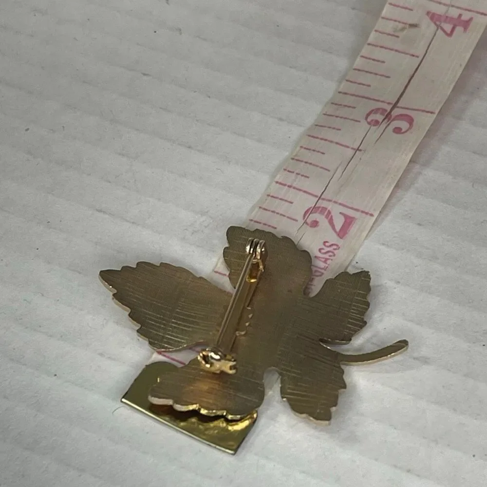 Vintage enamel maple leaf brooch.